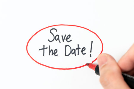 Handwriting text Save The Date with red marker pen, conceptual remember the schedule, appointment or invitationの写真素材
