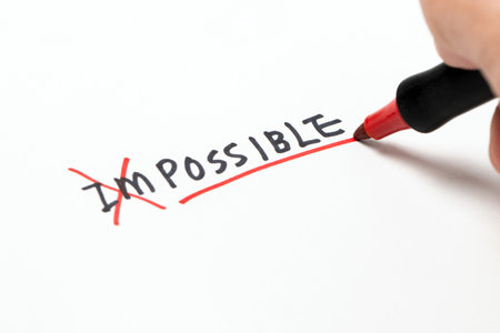 Changing the word impossible to possible, alphabet I and M being crossed with red marker pen, concept of change and possible.の写真素材