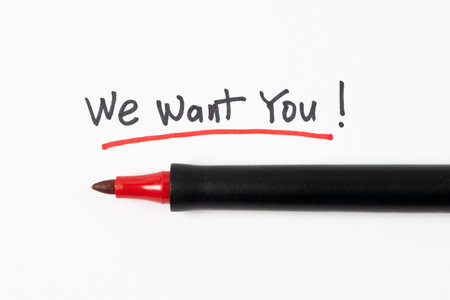 Hand writing We Want You with black marker and underline with red marker isolated on white background, concept of recruitment and hiringの写真素材