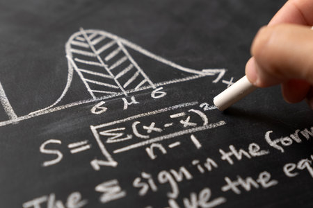 Bell curve graph and standard deviation formula is drawn on blackboard to illustrate data distribution and mathematic conceptの写真素材