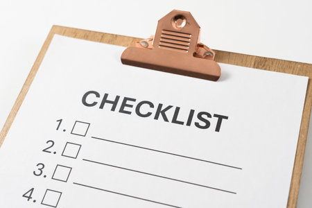 Close up of white blank checklist on the wooden clipboardの写真素材