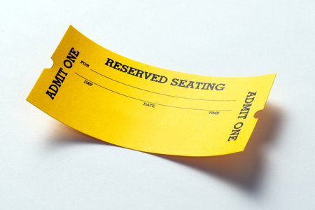 Single yellow vintage admission ticket stub isolated on white background, ark curveの写真素材