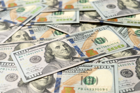 Numbers of United States hundred dollar currency notes on flat tableの写真素材