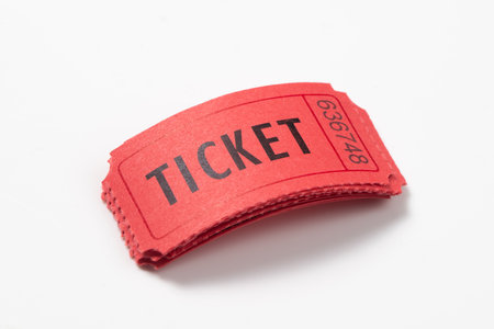 Stack of red vintage admission tickets isolated on white backgroundの写真素材