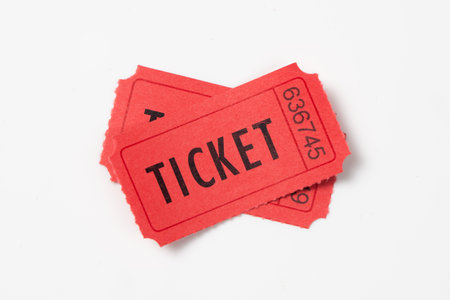 Two red vintage admission tickets isolated on white backgroundの写真素材