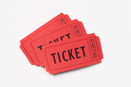 Three red vintage admission tickets isolated on white backgroundの写真素材