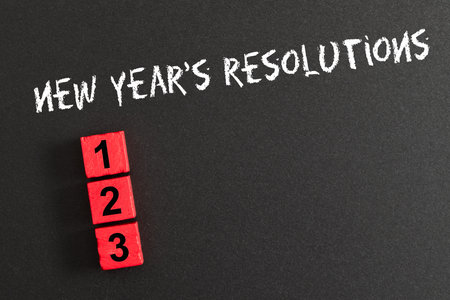 Three new year resolutions blank list on black chalkboardの写真素材