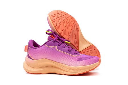Pair of generic purple pink sport shoes isolated on white backgroundの写真素材