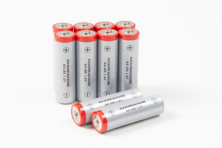 AA alkaline LR6 1.5V batteries isolated on white background, themes of portable power, energy, and...