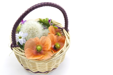 This is a flower basket made of wild grass の写真素材
