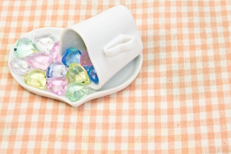 This is a picture of the colorful heart on a saucer.の写真素材