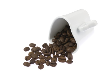 This is a photo of a heart-shaped cup and coffee beans の写真素材