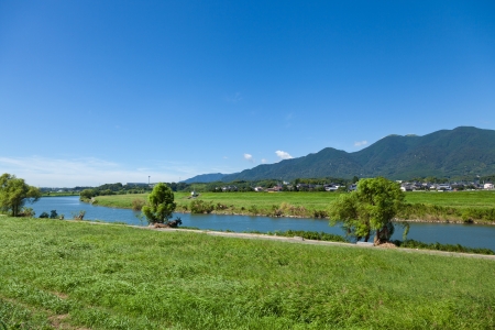 This is a photo of the riverside landscape of summer I took in August.の写真素材