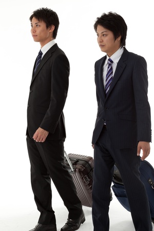 This is a picture of two young businessmen on a business trip.の写真素材