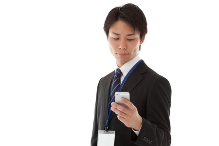  a businessman working with smartphone.の写真素材
