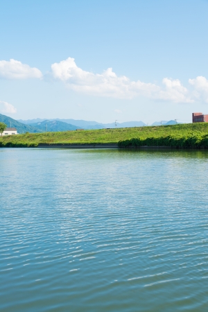 This is a photo of a summer sky and river.の写真素材
