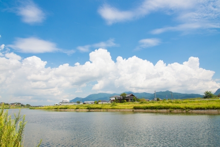 This is a photo of a summer sky and river.の写真素材