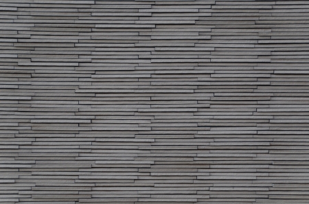This is a wall made ??by stacking flat stones.の写真素材