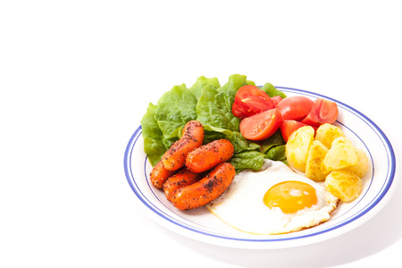 vegetables, sausage and fried egg.の写真素材
