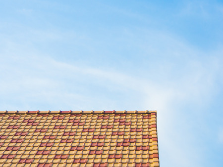 This is a blue sky and colorful roof.の写真素材
