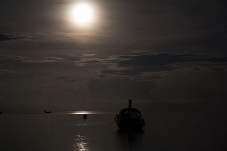 Dark sea under the moon lightの写真素材