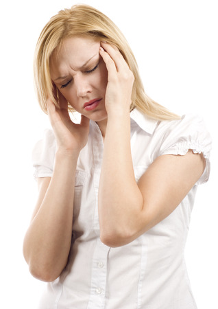 woman with headache holding her head with hands isolated over whiteの写真素材