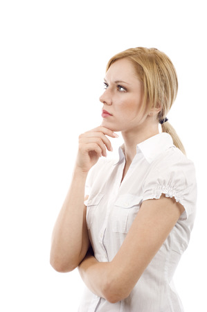 Beautiful young business woman standing and looking up at the copyspaceの写真素材