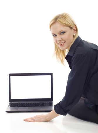 Business woman with a blank screen latop on white backgroundの写真素材