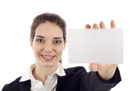 Portrait of a happy young woman with bussiness card isolated over white backgroundの写真素材