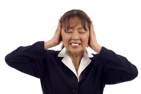 Asian business woman hear no evil isolated over white backgroundの写真素材
