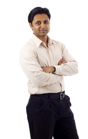 Portrait of a confident Indian business man with hands folded isolated over white backgroundの写真素材