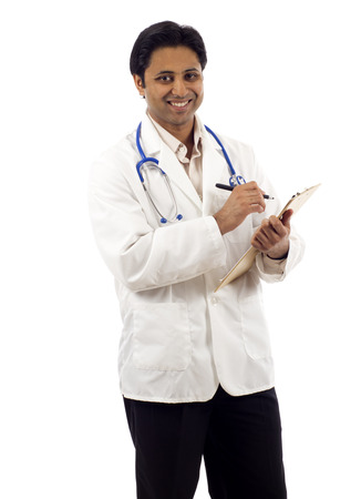Happy doctor with pen and clipboard isolated over white backgroundの写真素材
