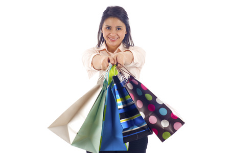 Woman shopping her shopping bags - Isolated over a white backgroundの写真素材
