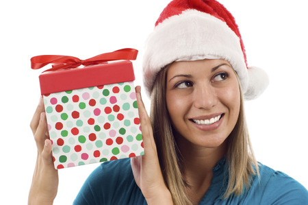 Christmas woman with present close up shoot isolated over white backgroundの写真素材