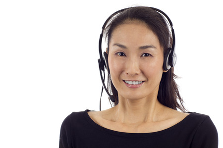 Female customer service operator isolated over white backgroundの写真素材