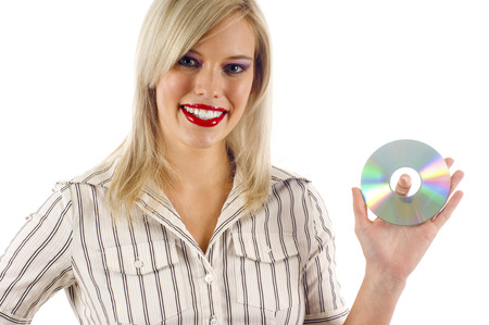 Beautiful Blond Woman Smiling and Holding a CDの写真素材