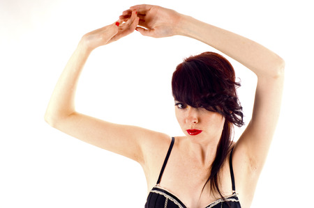 A sexy woman posing in lingerie against white background - copyspaceの写真素材