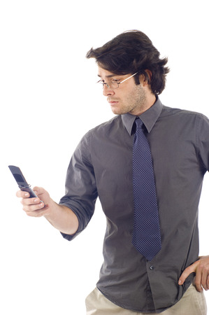 Portrait of Business Man Sending a Text Message Using Mobile Phone Isolated over a White Backgroundの写真素材