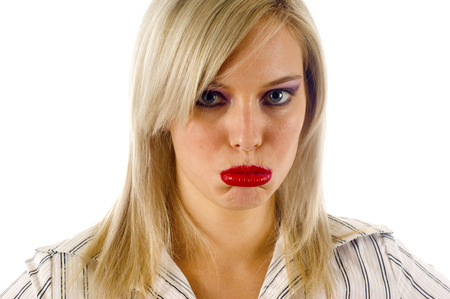 Upset Beautiful Blond Girl on White Backgroundの写真素材