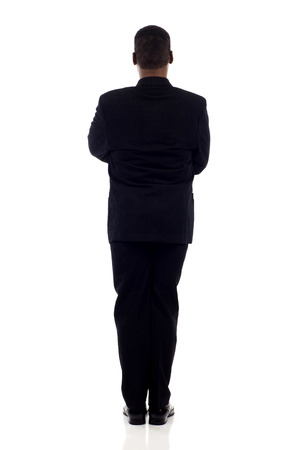 Full length African American business man standing back view isolated over white backgroundの写真素材