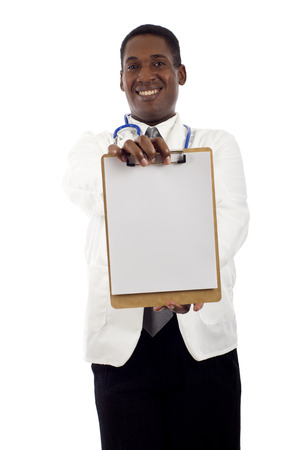 African American doctor holding a clipboard isolated over white backgroundの写真素材