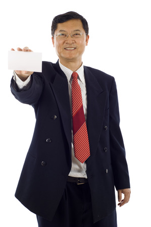 Senior Asian business man holding a blank card isolated over a white backgroundの写真素材