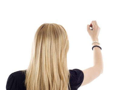 A business woman writing something isolated on white background.の写真素材