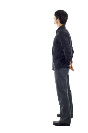 Business man from the back - looking at something over a white backgroundの写真素材