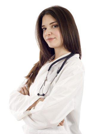 Portrait of a confidnet female doctor with hands folded isolated against whiteの写真素材