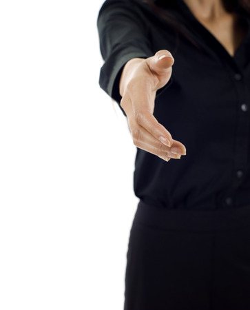 A business woman with an open hand ready to seal a dealの写真素材