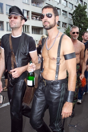 Berlin Germany, June 23 2012, Two men dressed in leather walking together at the Berlin Christopher street day paradeのeditorial素材