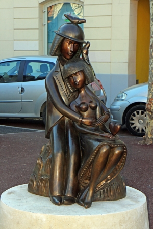 Antibes, France, 15th February, 2013, A bronze statye of a man and a woman on place nationaleのeditorial素材