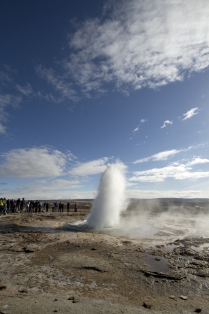 March 29th 2013, Strokkur geyser on Iceland is erupting, throwing water in the blue sky  Photo 1 out of 6の写真素材