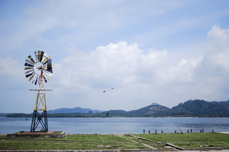 Garden windmill by the seaの写真素材